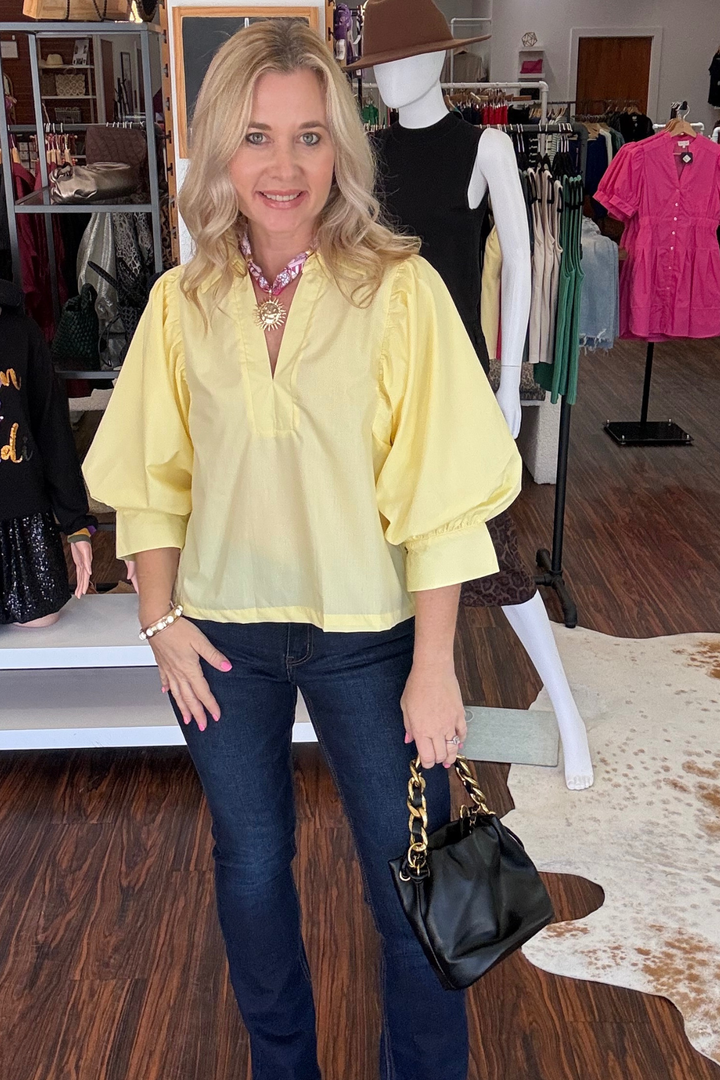 
This versatile 3/4 sleeve top combines contemporary style with everyday comfort. The flattering V-neck and distinctive pleated shoulder detailing add visual interest, while the lightweight woven fabric moves with you throughout the day. Unlined and non-sheer, it's designed for effortless layering or standalone wear. Perfect for transitioning between seasons or dressing up casual basics.