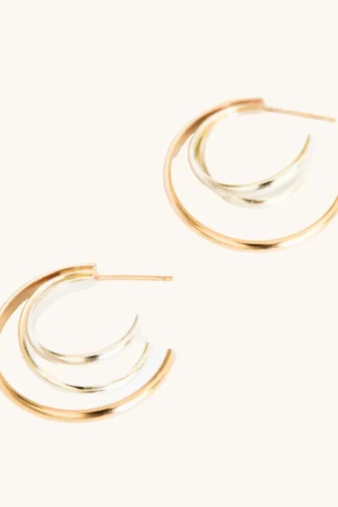 Able Two-Tone Trio Hoops

Elevate your everyday look with the Able Two-Tone Trio Hoops, a modern take on a timeless classic. Crafted from 14k gold-fill and sterling silver, these lightweight hoops deliver sophisticated style without the weight. Designed for all-day comfort, they're hypoallergenic and tarnish-resistant, making them perfect for sensitive skin and minimal maintenance. Each pair is handcrafted in Nashville, TN, bringing artisanal quality to your jewelry collection.