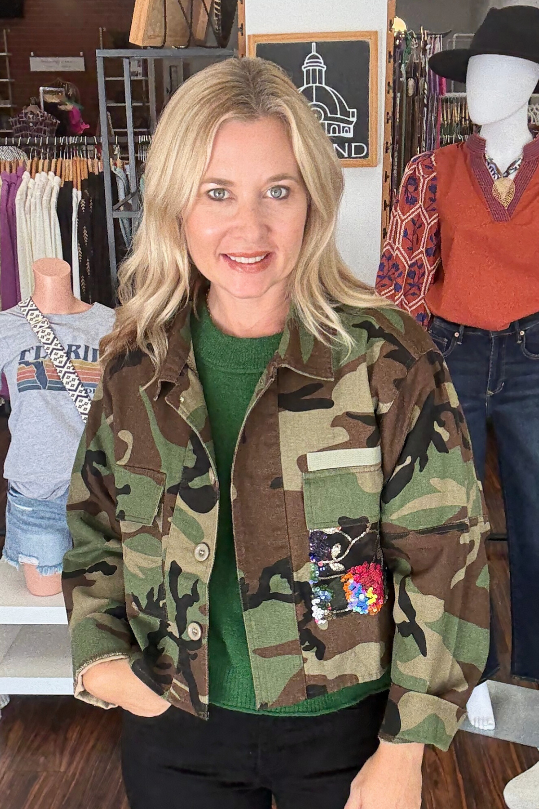 camo cropped jacket with floral sequin detail on the back and front pocket. 