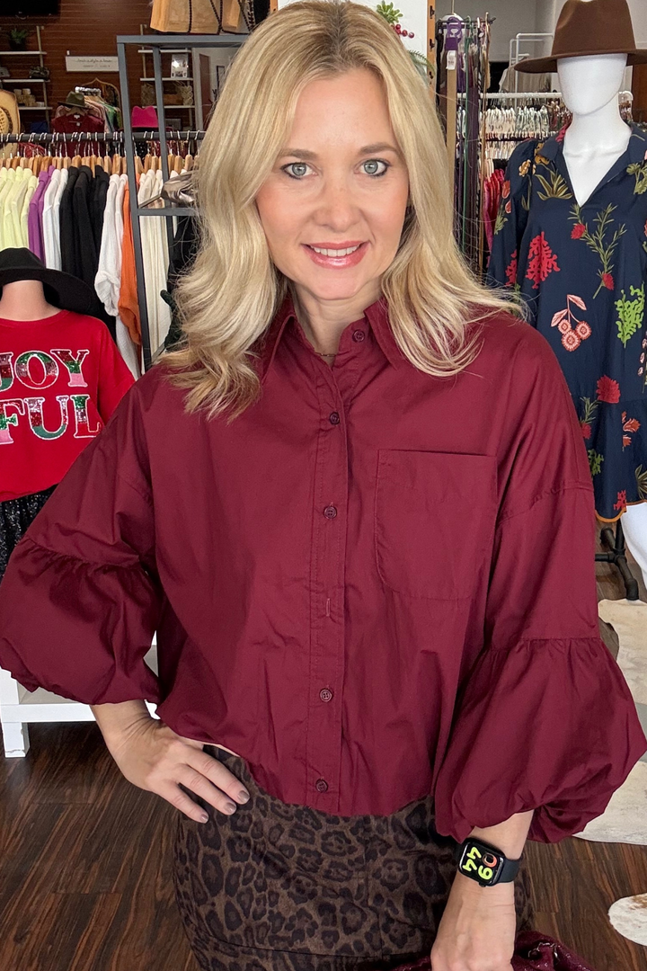 Elevate your wardrobe with our Collared Button-Down Bubble Top. Featuring a chic collared neckline with a button-down placket, drop shoulder design, and 3/4 sleeves with balloon cuffs. The bubble hem adds a touch of whimsy to this sophisticated top. 