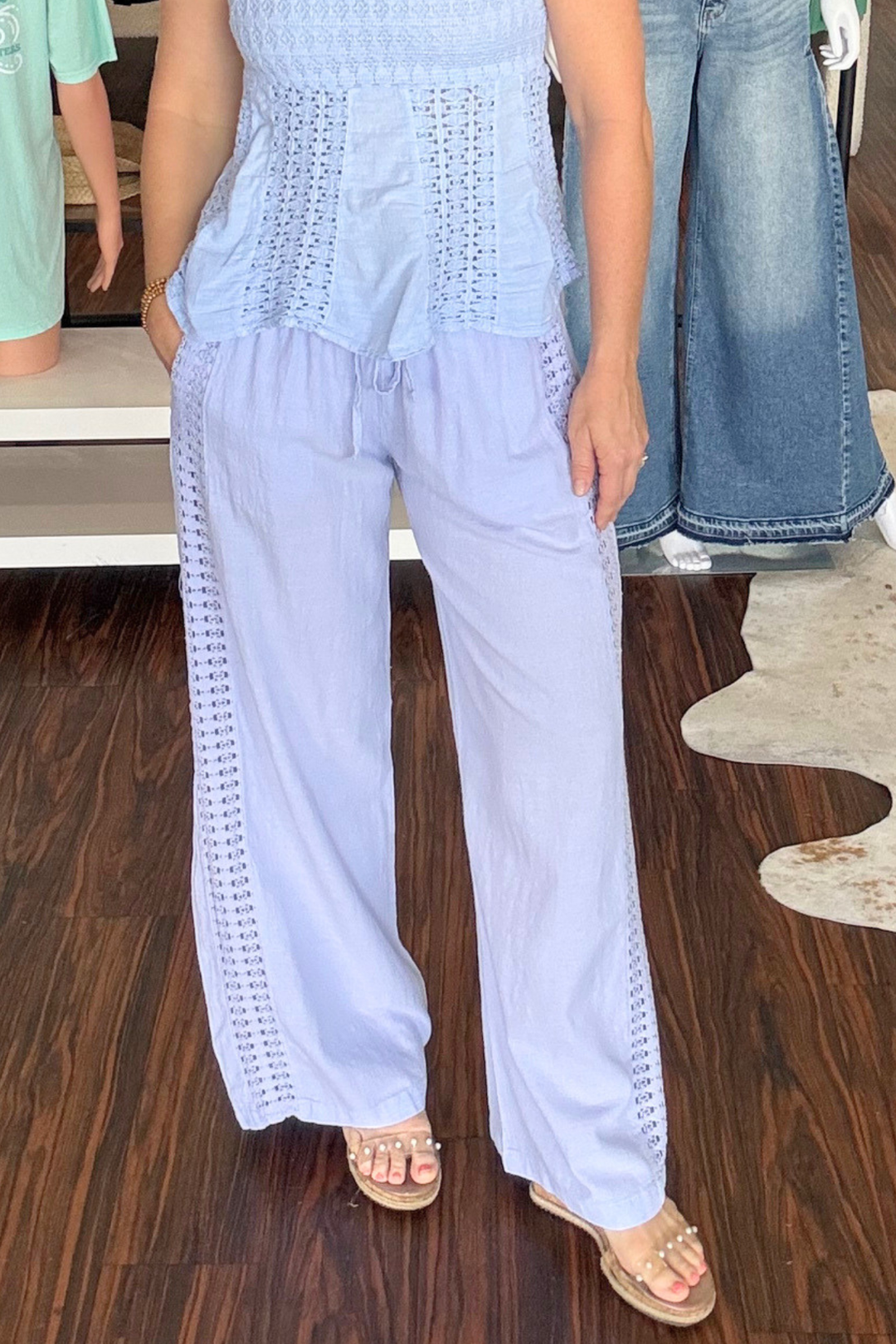 Effortless comfort meets bohemian style with these cotton wide leg pants. Crafted from soft, breathable cotton, they feature an intricate crochet detail running down each leg for a unique, handcrafted aesthetic. The adjustable drawstring waist ensures a perfect fit for all body types, while the relaxed wide leg silhouette provides freedom of movement and a flattering drape. Perfect for casual outings, beach days, or layering over your favorite swimwear.
