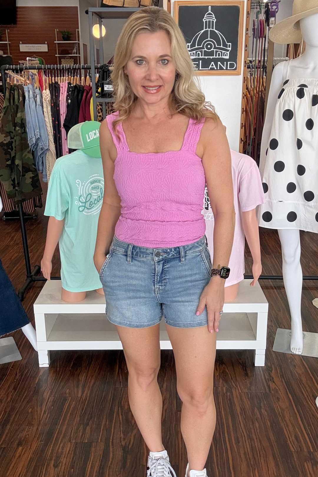 high-rise stretch denim shorts. Designed with a flattering fit that sits comfortably at the waist, they offer the perfect balance of classic denim appeal and modern comfort. The stretch fabric moves with you, making them ideal for everything from casual outings to relaxed weekend wear. The medium-light wash creates a versatile look that pairs effortlessly with your favorite tops and accessories.