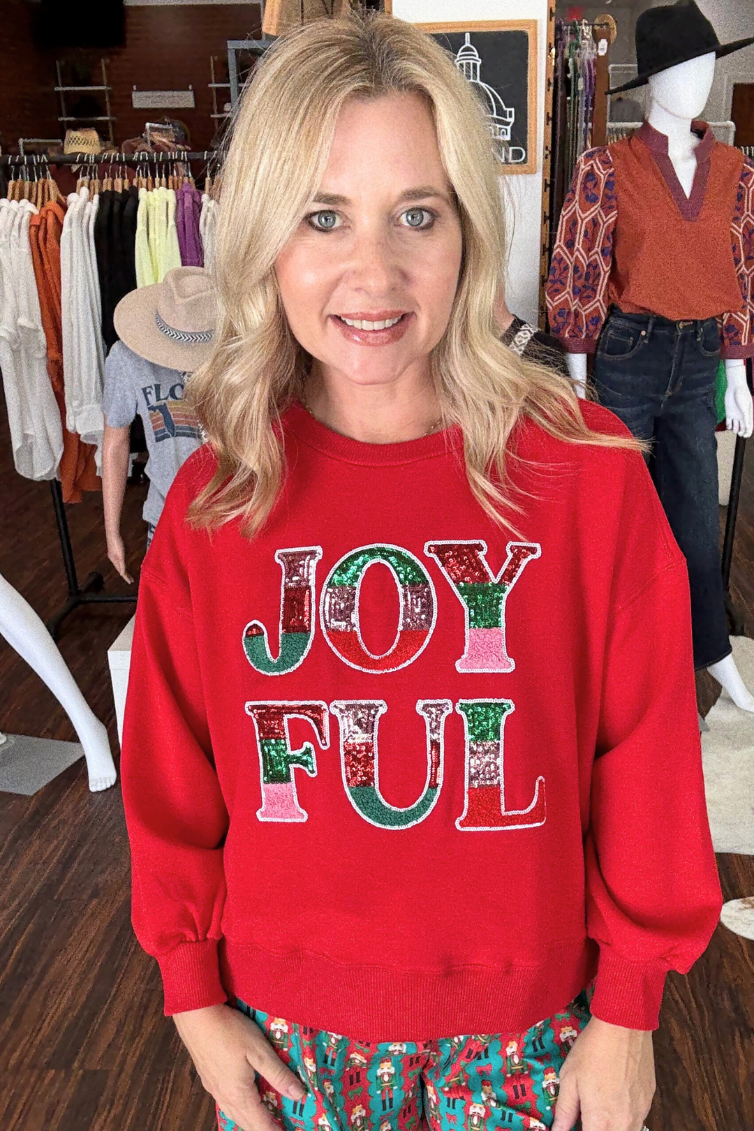  Joyful Millie Sweatshirt combines a cropped silhouette with bold, full-volume sleeves for a fresh, modern look. This super soft red sweatshirt features JOY FUL in sequin lettering across the front. Its relaxed fit and classic crew neckline offers casual comfort