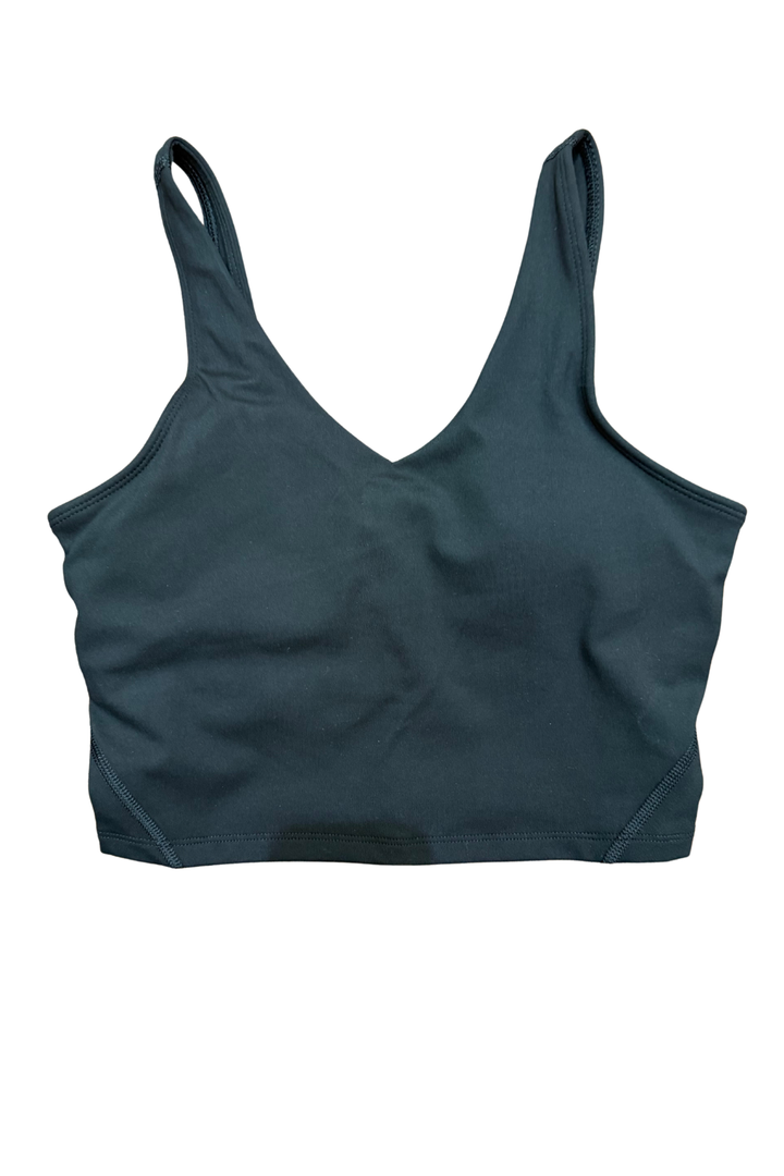 The Local Girl Tank Top combines comfort with functionality in a cropped silhouette designed for everyday wear. Crafted from soft, buttery fabric that feels luxurious against your skin, this tank features a built-in sports bra with removable padding so you can customize your support. Local Girl logo on the back. Whether you're layering it or wearing it solo, this versatile piece transitions seamlessly from casual outings to active moments.