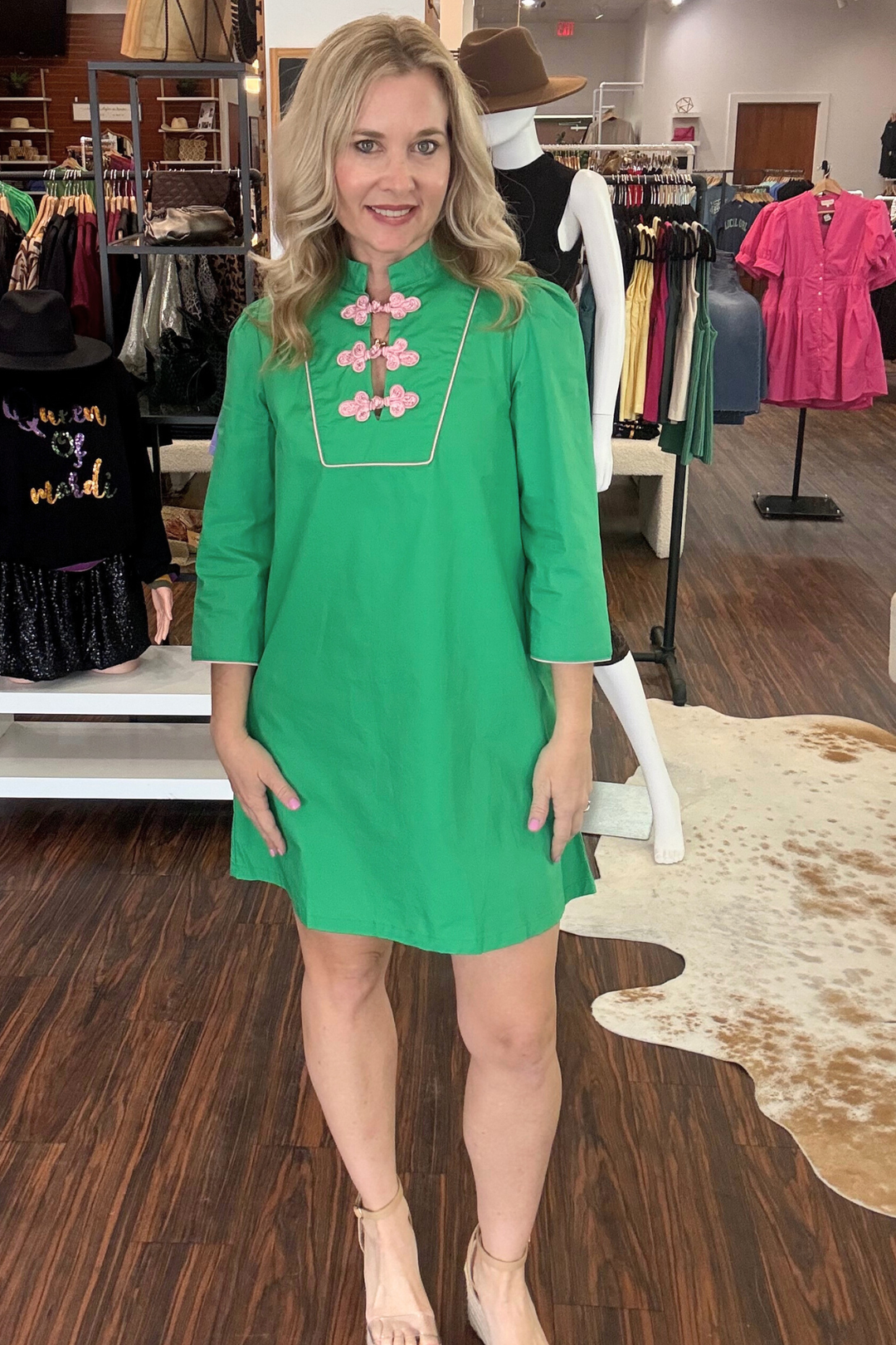 Elevate your everyday wardrobe with this contemporary mini dress that blends classic elegance with modern edge. The mandarin collar and ornamental frog button closures deliver vintage-inspired charm, while the straight silhouette offers a flattering, effortless fit. Three-quarter sleeves provide versatile layering options, and delicate pink contrast piping adds a subtle pop of color. 