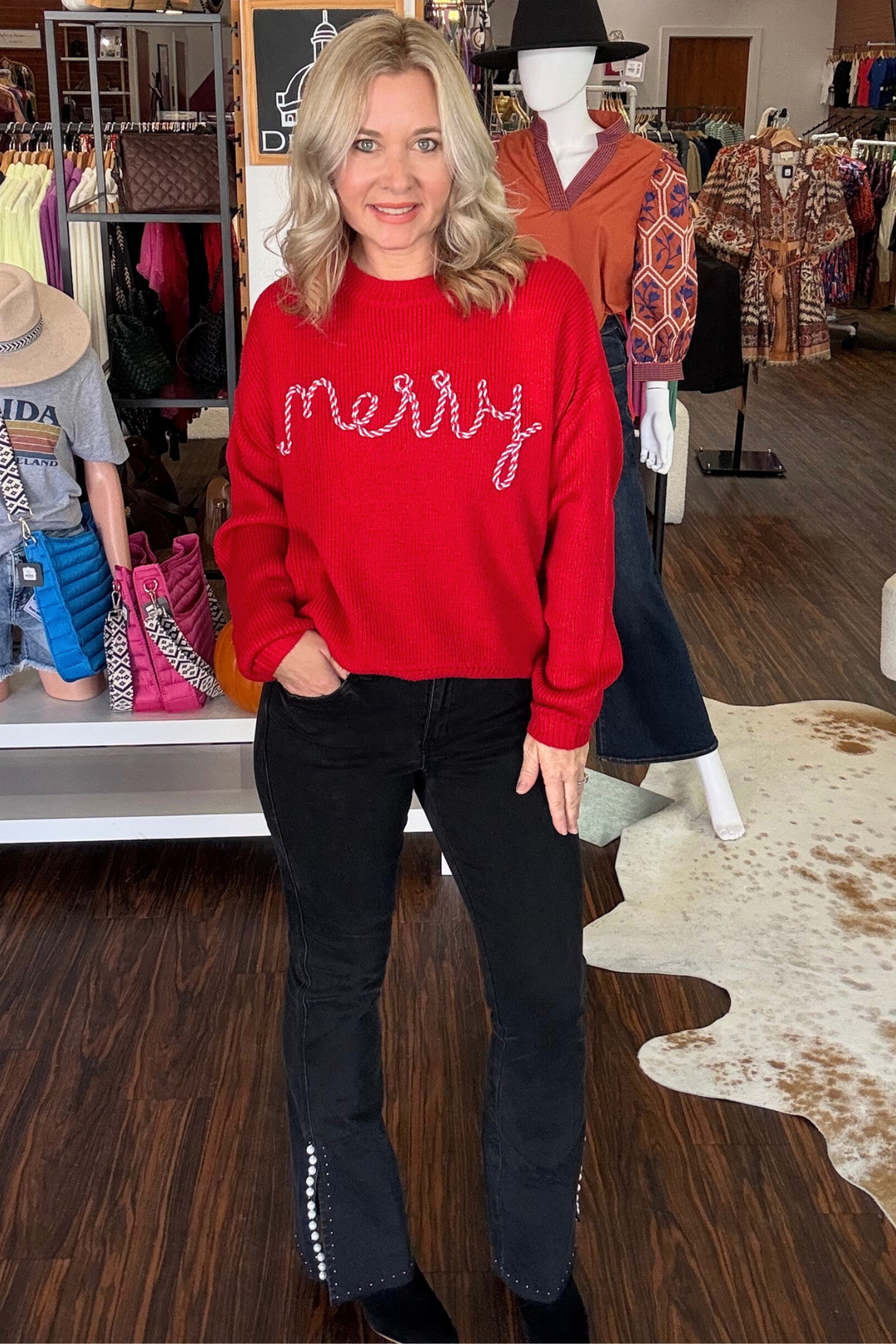 Celebrate the season in style with this modern red sweater featuring the word "Merry" knit in a festive candy cane stitch across the front. Its cozy design keeps you warm while adding a playful, contemporary touch to your holiday wardrobe. Perfect for spreading cheer at gatherings or casual winter day