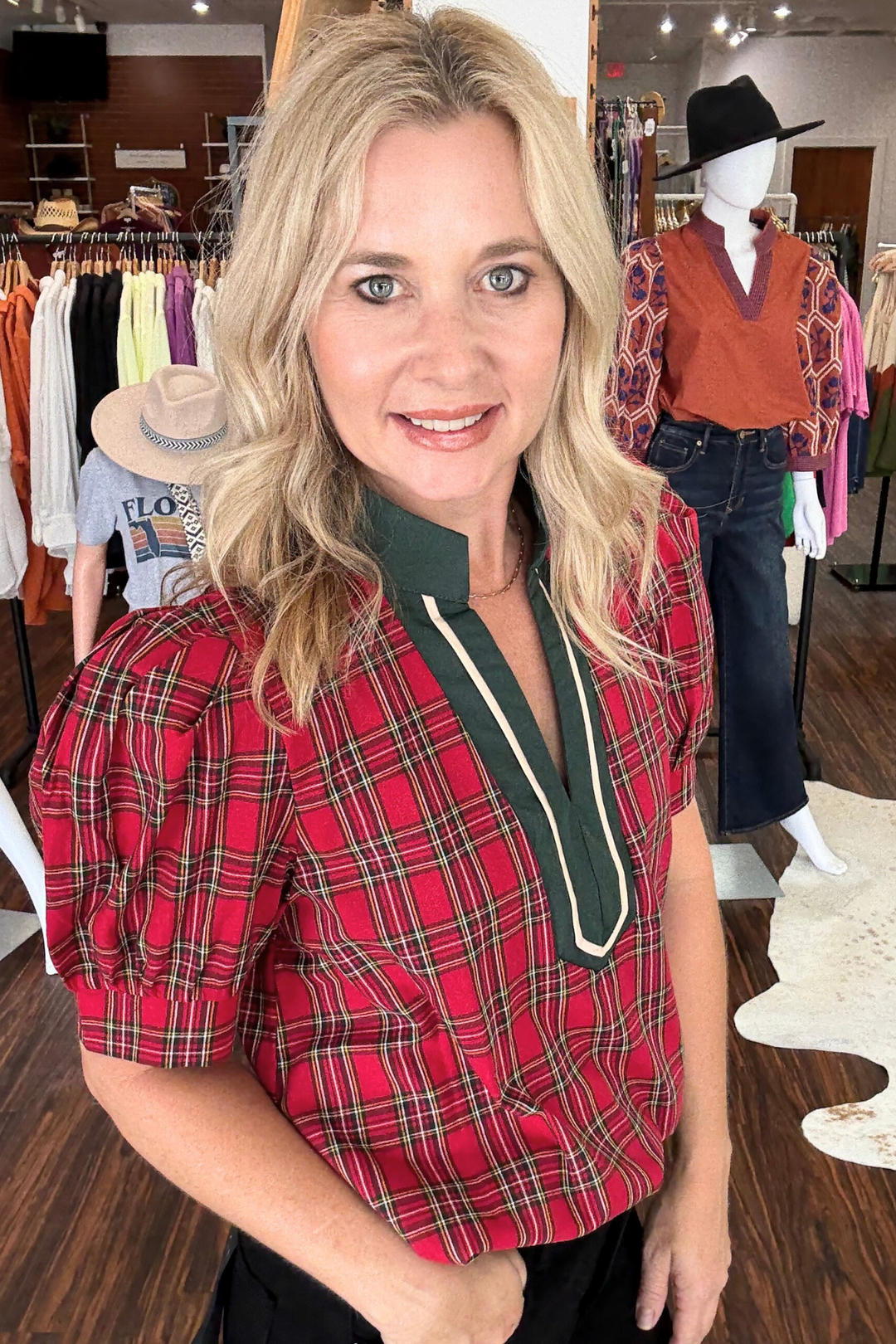 The Plaid V-Neck Top with Puff Sleeve features a stylish contrast V-neckline paired with charming short puff sleeves for a contemporary silhouette. 
