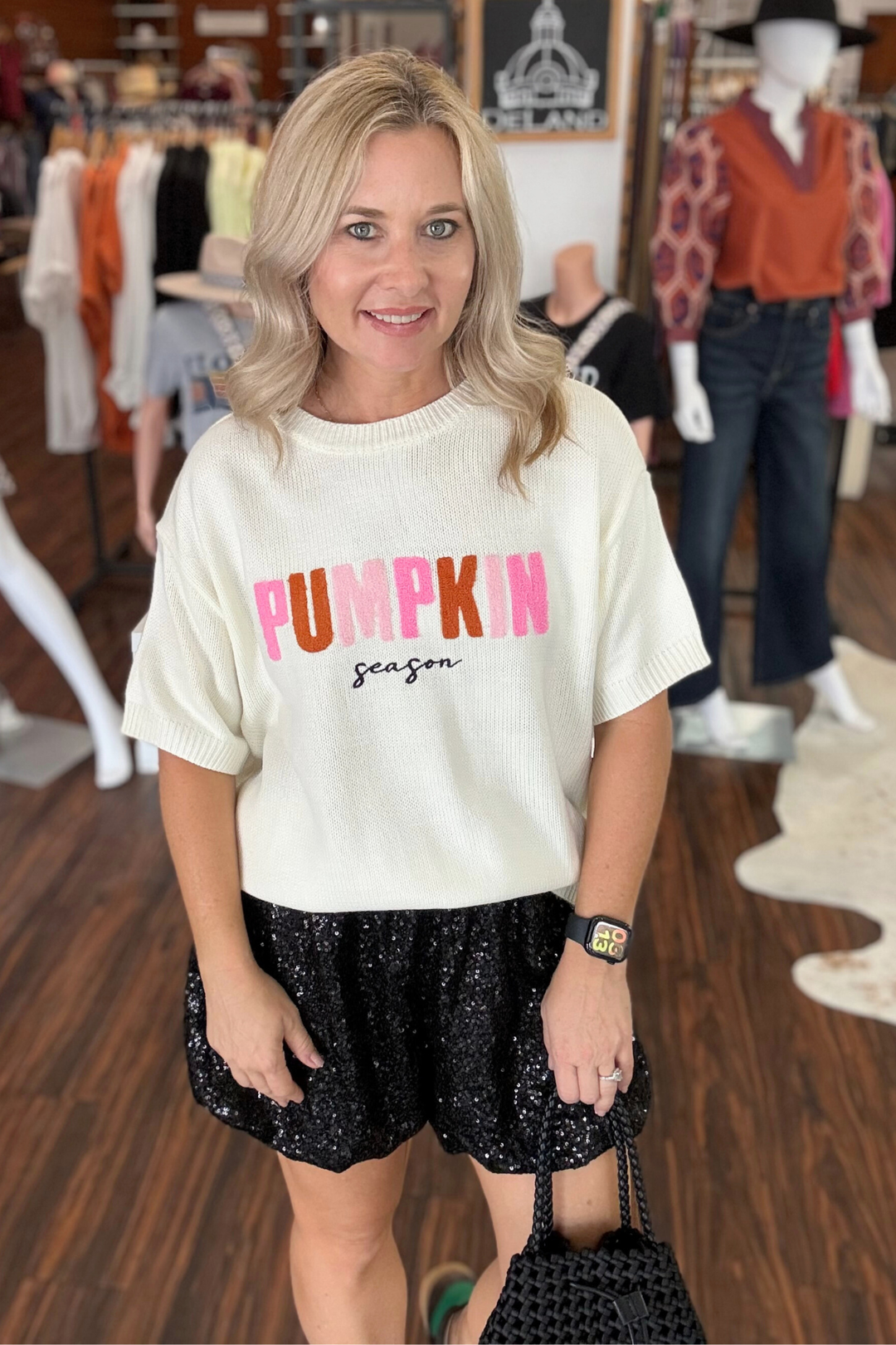 Pumpkin Season Short Sleeve Sweater

Embrace cozy vibes with this Cream Short Sleeve Sweater, featuring "Pumpkin Season" spelled out in vibrant chenille pink and orange letters. Its soft texture and relaxed fit make it perfect for layering during crisp autumn days, combining festive style with everyday comfort.