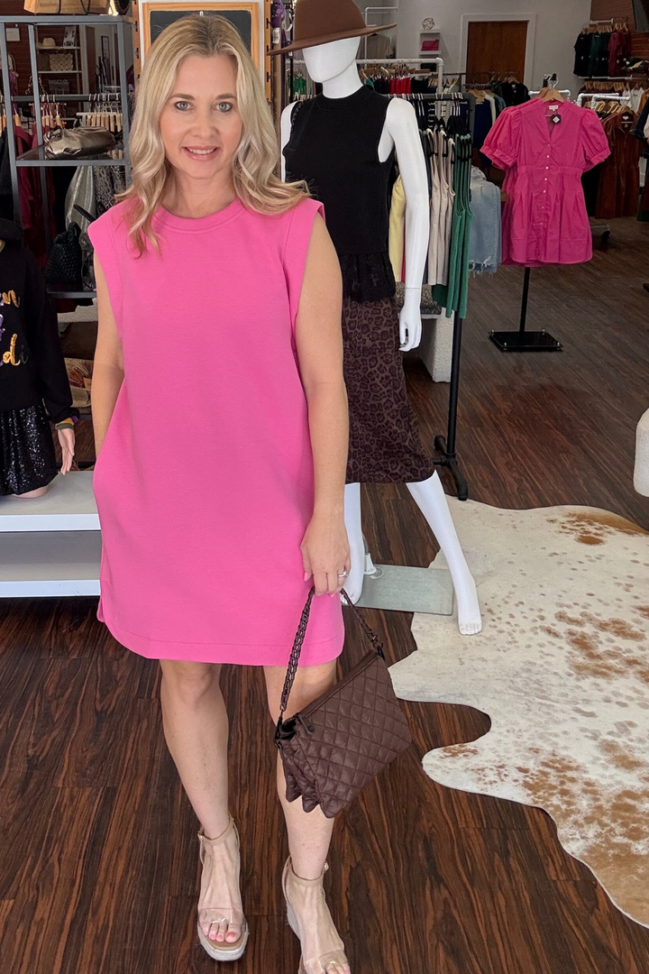 
Effortless and versatile, this round neck mini dress combines comfort with contemporary style. Featuring a sleeveless silhouette with practical side pockets. Crafted from lightweight knit fabric that's non-sheer and unlined, it moves with you throughout the day. Perfect for casual outings or dressed up for evening plans.