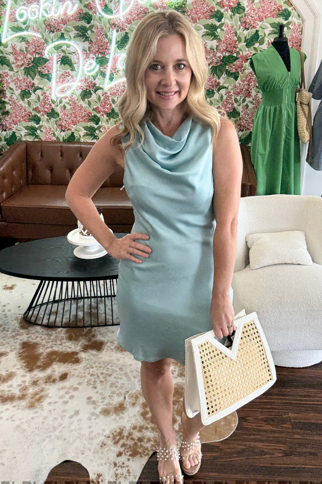  Satin Cowl Neck Mini Dress is designed with a stylish cowl neck and a flowy hem, perfect for elegant evening events. The sleeveless design and button closure at the back of the neck add a touch of sophistication