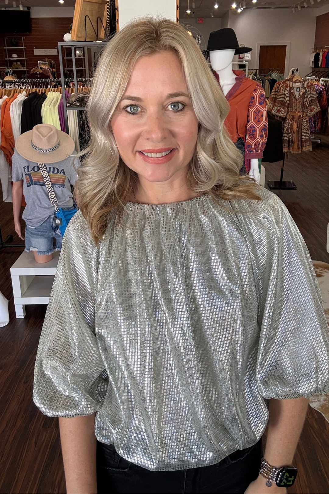 Silver Sparkle Bubble Hem Top

Elevate your style with this modern Silver Sparkle Bubble Hem Top. Featuring 3/4 sleeves and an elasticized hem and cuffs, it offers a comfortable yet chic fit. The bubble hem adds a playful silhouette, while the shimmering silver sparkle fabric brings a subtle shine to your look. Fully lined for smooth wear, this top effortlessly blends comfort and contemporary flair.