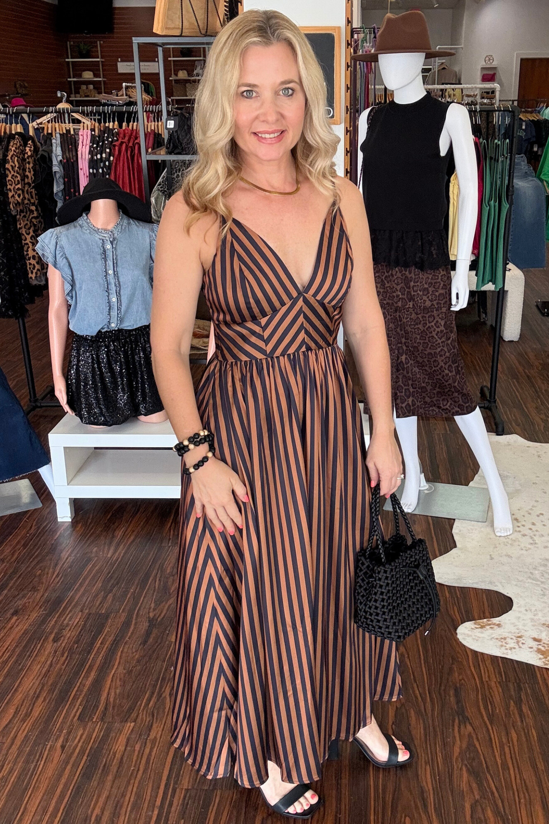 
Elevate your wardrobe with this charming striped midi dress, designed for effortless elegance. The V-neckline and adjustable straps offer a flattering silhouette, while the chevron-striped bodice beautifully defines your waist. A smocked back panel provides comfort and movement, secured with a discreet invisible zipper. Vertical stripes flow gracefully down the A-line skirt, creating a dynamic, slimming effect. Perfect for brunch, casual outings, or weekend gatherings. 