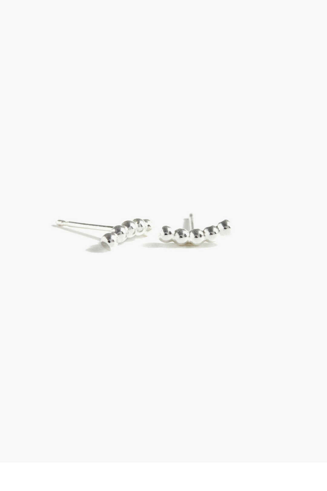 Able Caesar Stud Earrings

These versatile Caesar studs transition seamlessly from everyday wear to statement-making moments. Crafted in 14k gold fill, the 10mm beaded texture adds subtle dimension and visual interest. The innovative design allows you to wear them horizontally or vertically, giving you flexibility to match your mood and style. Perfect for layering or standing alone, these earrings are a modern essential that works as hard as you do.