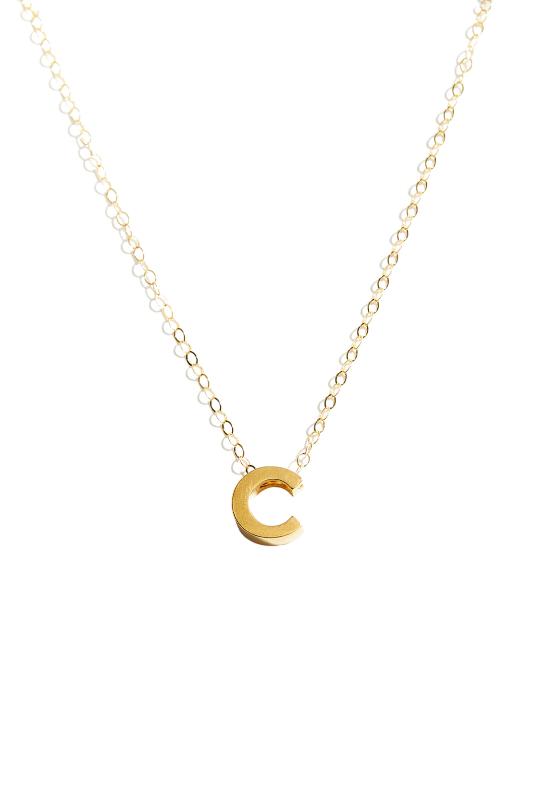 Personalize your everyday style with this delicate letter charm necklace. The 8mm vermeil pendant showcases your initials or meaningful letters—up to 6 characters—suspended from an 18" gold-filled chain that's built to last. Perfect for layering or wearing solo, this versatile piece transitions seamlessly from day to night, making it an essential addition to any jewelry collection.